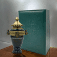 Majestic Woody Intense by Arabian Oud, dark green urn-style bottle with gold detailing